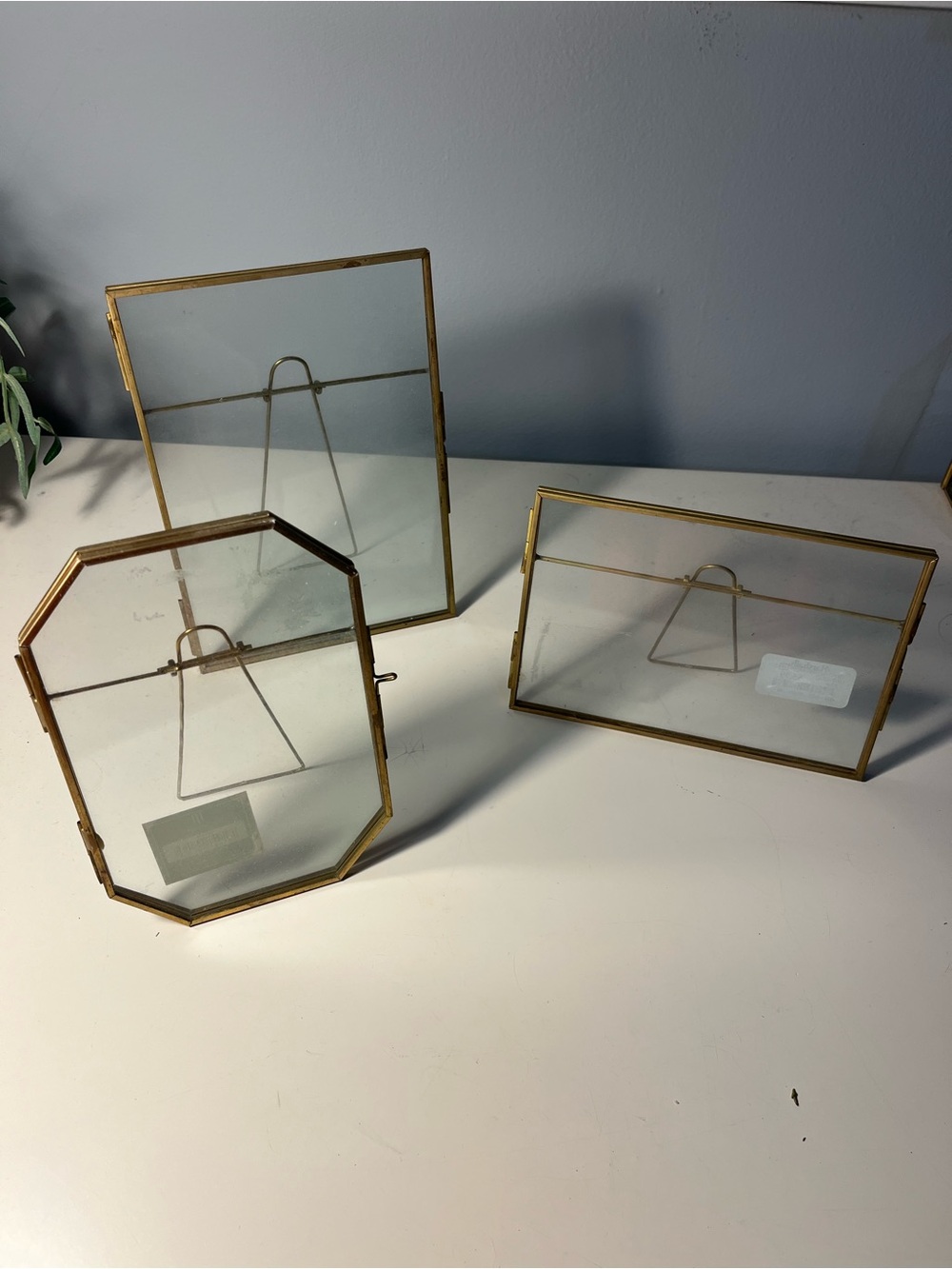 Three gold floating photo frames
